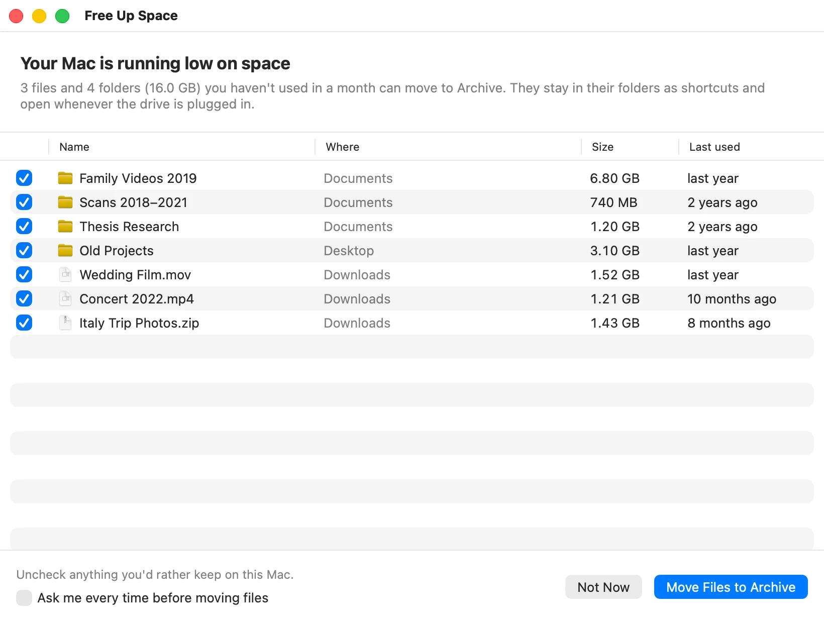 The Free Up Space window: “Your Mac is running low on space.” It lists files and folders not used in a month, such as Family Videos 2019 (6.80 GB) and Wedding Film.mov (1.52 GB), each with a checkbox, and the buttons Not Now and Move Files to Archive.